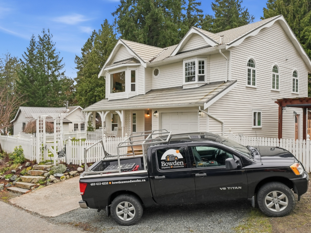 The Bowden Renovations & Additions truck is parked in front of a recently renovated home done by us.